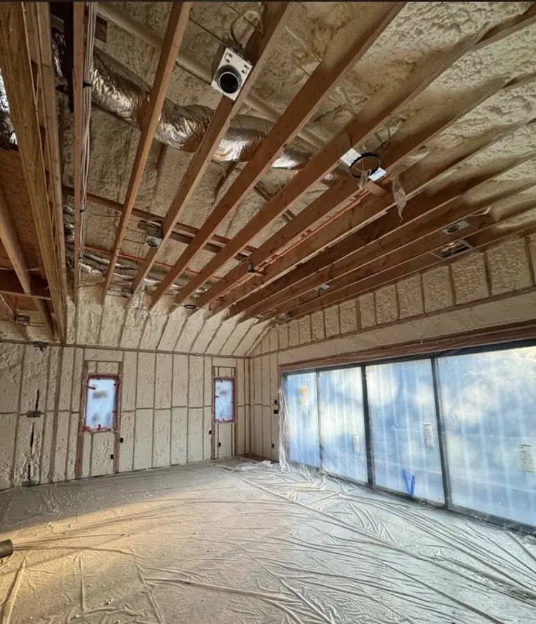 Interior walls and ceiling insulated with spray foam during new construction in Center Line